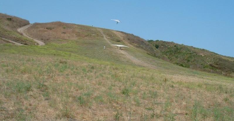 student flying off top of training hill